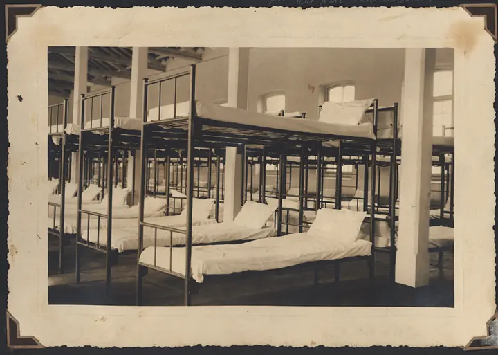 Another Hospedaria dormitory, with two-tier iron bunk beds.