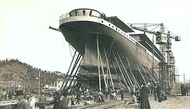 The hull at the Riva Trigoso shipyard in 1908, still without funnels or superstructure: after her twin, the Principessa Jolanda, capsized when launched fully fitted, this ship went down the slipway light and was finished afloat.