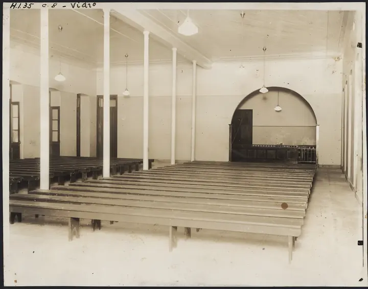 The roll-call hall: long benches in rows. Here people waited until their name was called out.